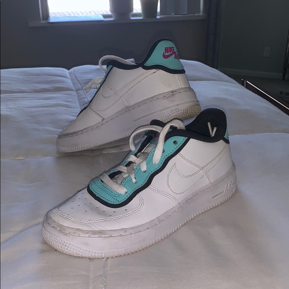 Nike Air white and teal sneakers.